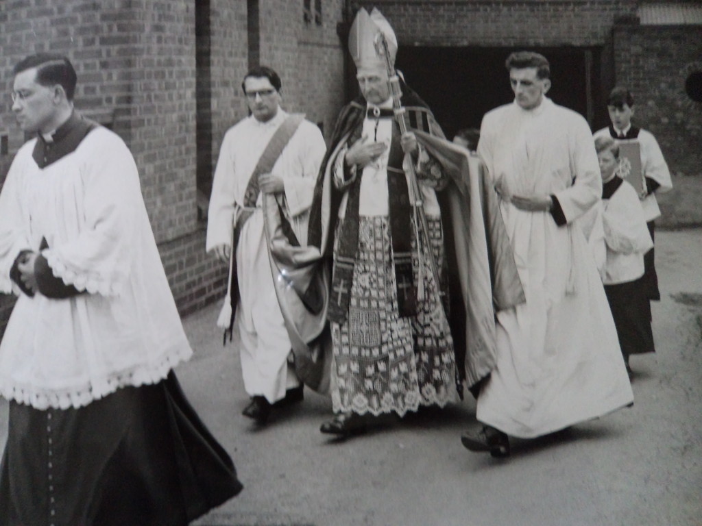 A bishop entering the church with clergy