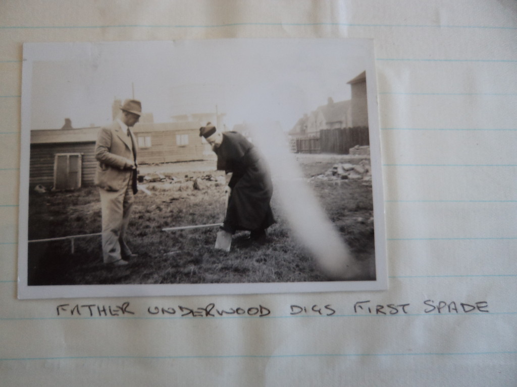 An archival photograph mounted on a page with a handwritten note