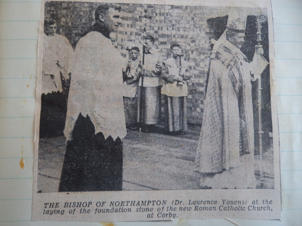 A printed photograph of a bishop at an outdoor ceremony