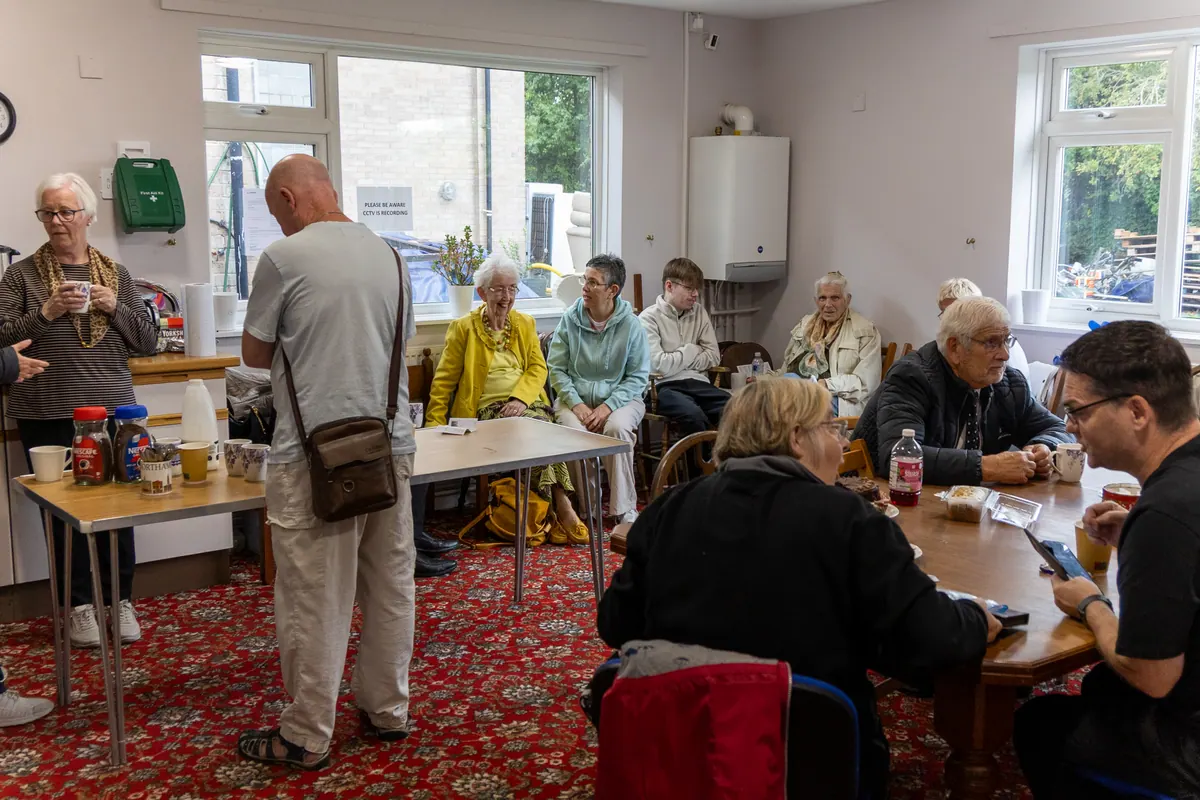 Parishioners sharing refreshments in a room at St Brendan’s